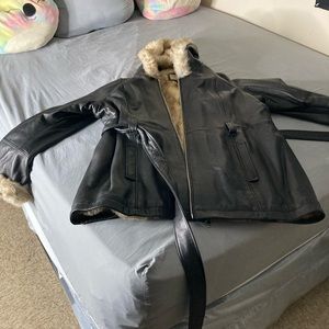 Soft black women’s belted leather coat